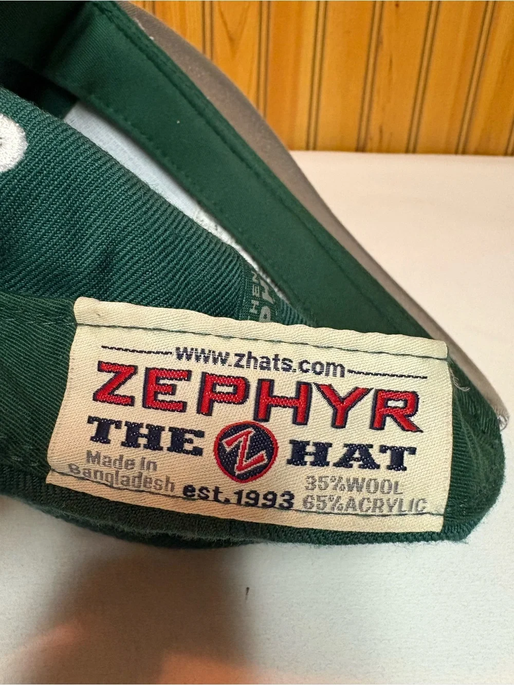 Zephyr Green Hat with Red and Navy Logo Patch